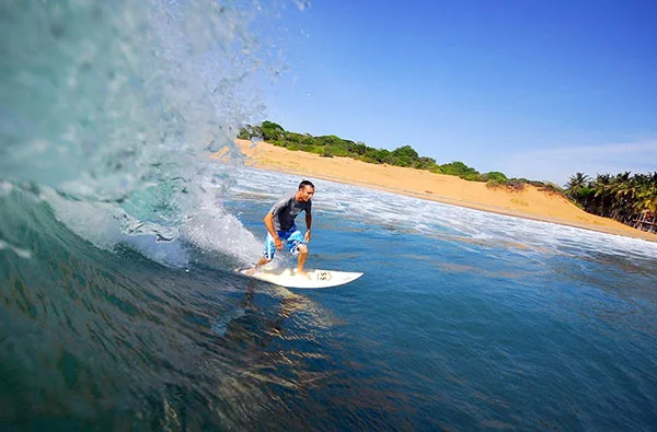 Sri Lanka surfer on a golden coast
